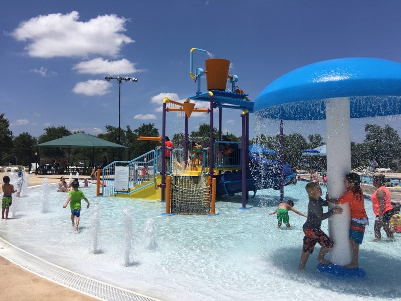 https://kidventure.com/wp-content/uploads/2023/12/10-cool-pools-in-austin-to-check-out-this-summer-Cedar-Park-Splash-Pad-Pool-810x608.jpg