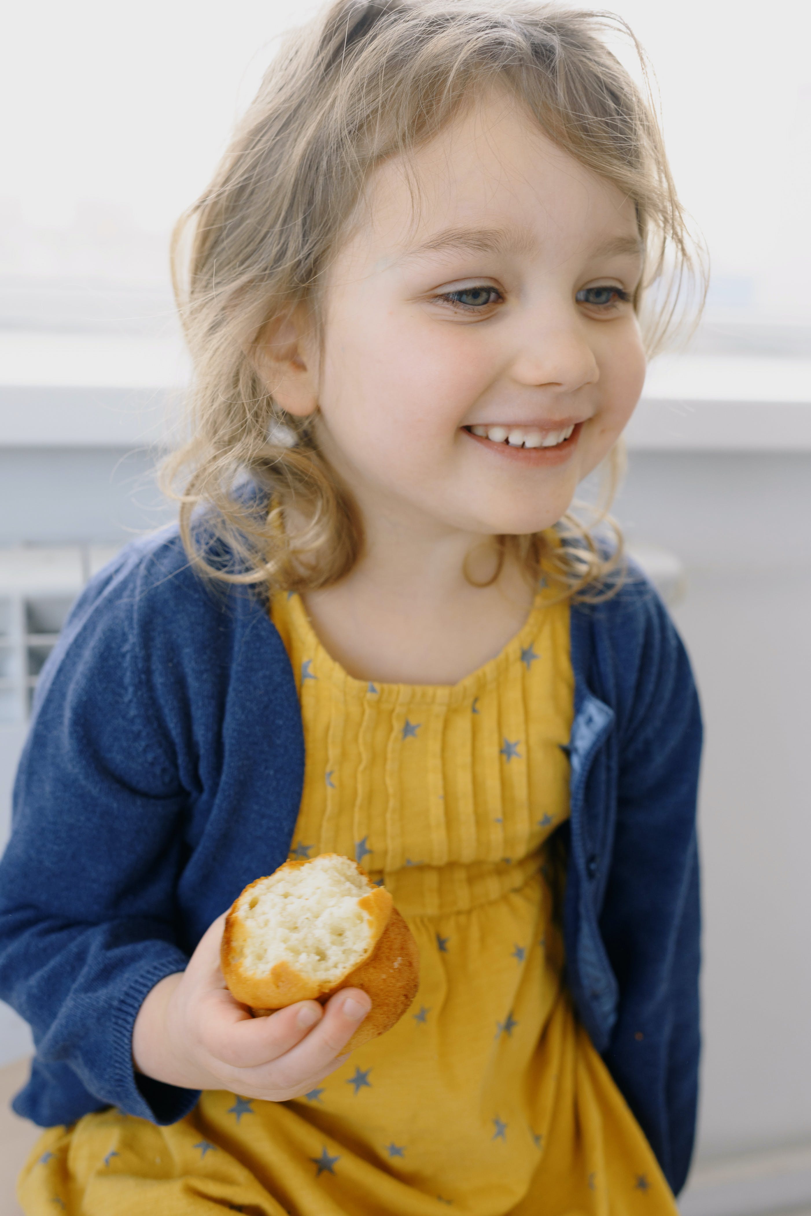 Photo Of Child Holding Bread